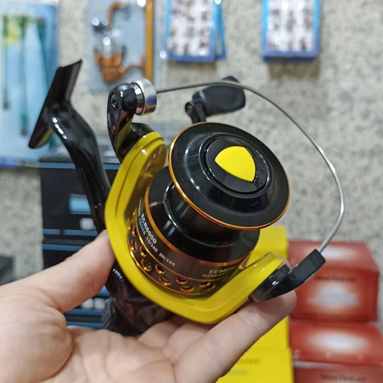 چرخ ماهیگیری 6000 برند یوموشی مدل ECR6000 مناسب برای چوب ماهیگیری لنسر ماهیگیری