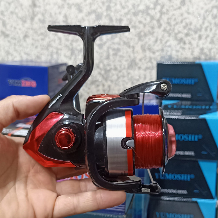 چرخ ماهیگیری 7000 برند یوموشی به همراه نخ مدل MK7000 مناسب برای چوب ماهیگیری لنسر ماهیگیری