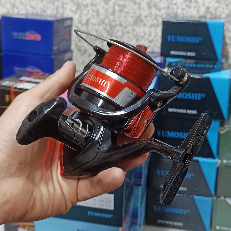 چرخ ماهیگیری 7000 برند یوموشی به همراه نخ مدل MK7000 مناسب برای چوب ماهیگیری لنسر ماهیگیری