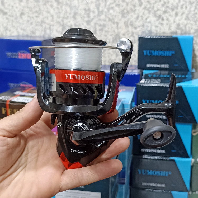 چرخ ماهیگیری 7000 برند یوموشی به همراه نخ مدل FF7000 مناسب برای چوب ماهیگیری لنسر ماهیگیری