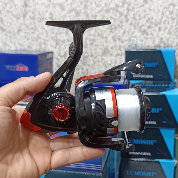 چرخ ماهیگیری 7000 برند یوموشی به همراه نخ مدل FF7000 مناسب برای چوب ماهیگیری لنسر ماهیگیری