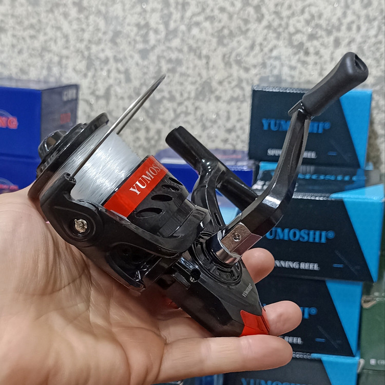 چرخ ماهیگیری 7000 برند یوموشی به همراه نخ مدل FF7000 مناسب برای چوب ماهیگیری لنسر ماهیگیری