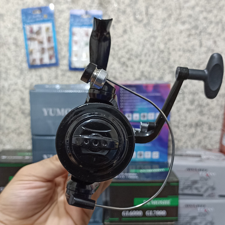 چرخ ماهیگیری 7000 برند یوموشی جیهان به همراه نخ مدل YF7000 مناسب برای چوب ماهیگیری لنسر ماهیگیری